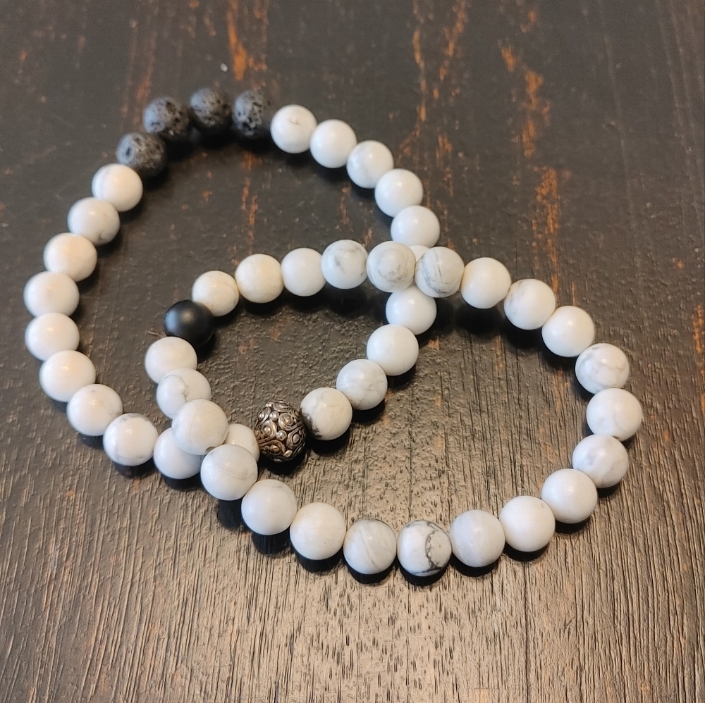 two beaded white & black bracelets.